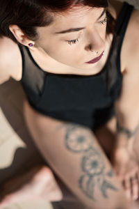 Close-up of young woman at home