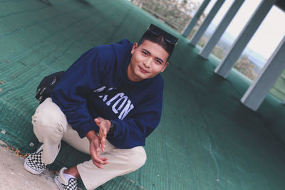 Portrait of a handsome young man standing outdoors