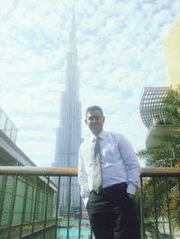 Low angle view of man standing on city street