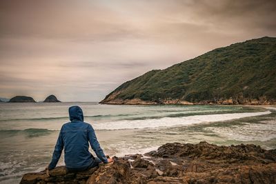 Rear view of man on beach