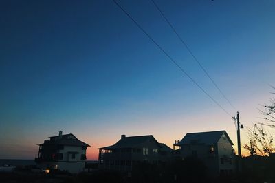 Houses against clear blue sky