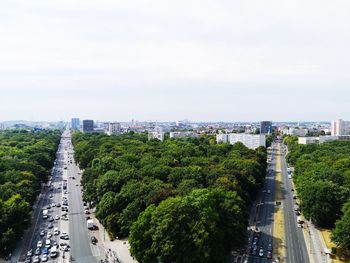 High angle view of street amidst buildings against sky