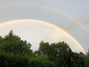 Low angle view of rainbow against sky