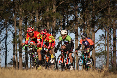 Group of people riding bicycle