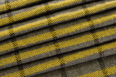 Woolen cloth, grey and yellow colors, pattern texture background