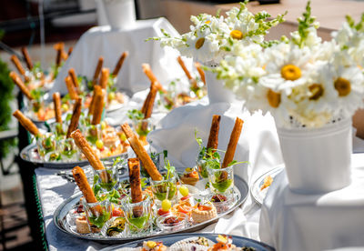 High angle view of appetizer served in plate on table at garden party