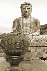 Statue of buddha against sky