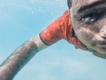 Close-up portrait of man swimming in pool