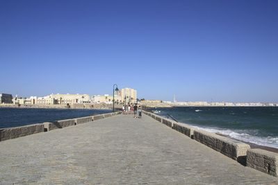 View of bridge against clear blue sky