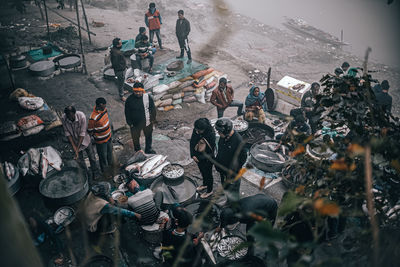 High angle view of people standing in city during winter