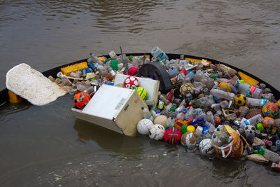 Plastic pollution - rubbish swept into the river lee, caught by a barrier 