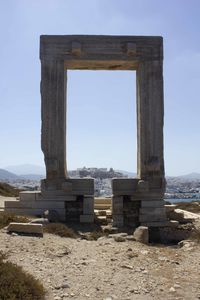 Built structure on beach against clear sky