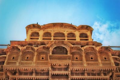 Low angle view of historical building against blue sky