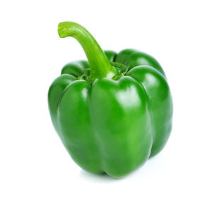 Close-up of green chili pepper against white background