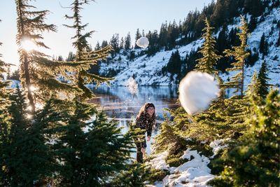 Rear view of person on snow covered land