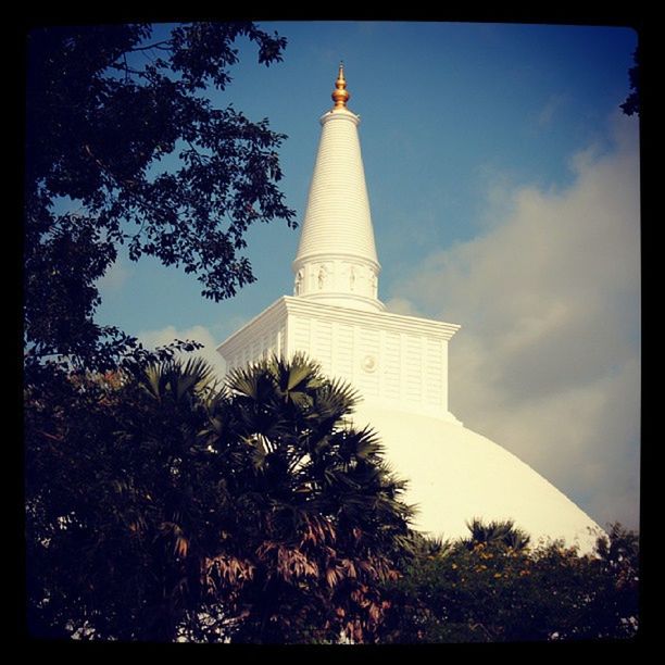 architecture, built structure, tree, building exterior, transfer print, low angle view, tower, sky, auto post production filter, place of worship, religion, famous place, spirituality, travel destinations, church, tall - high, blue, travel, history