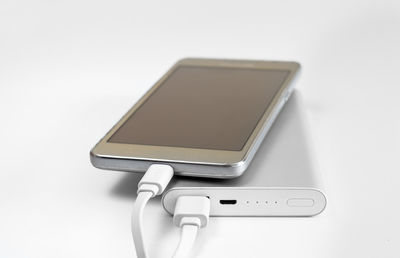 Close-up of smart phone on white background
