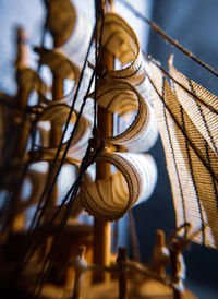 Low angle view of rope hanging on metal