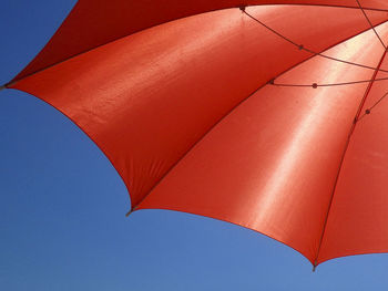 Low angle view of umbrella against sky