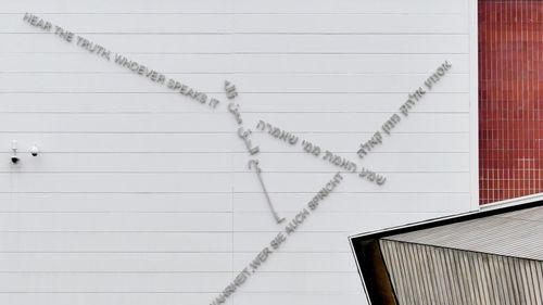 Close-up of white building against wall