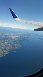 Cropped image of airplane flying over landscape