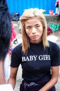 Portrait of a teenage girl standing outdoors