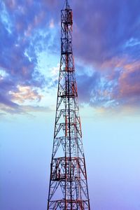 Low angle view of communications tower against sky
