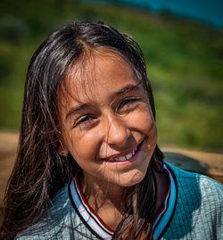 Close-up portrait of a smiling young woman