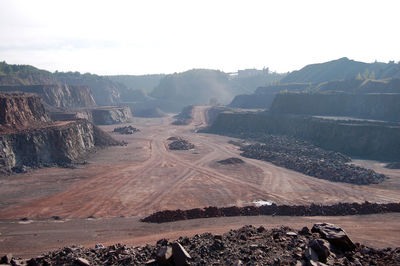 Scenic view of mining landscape against sky