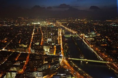 High angle view of illuminated buildings in city at night