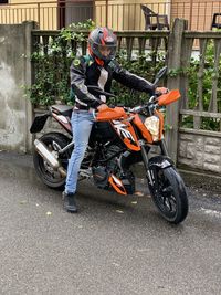 Man riding motorcycle on road