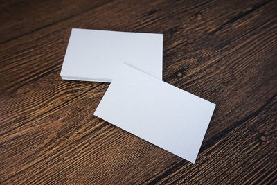 High angle view of paper on table against white background