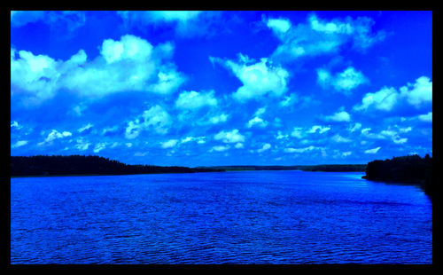 Scenic view of sea against cloudy sky