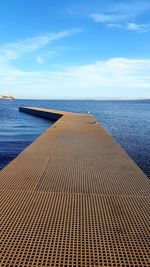 Scenic view of sea against blue sky