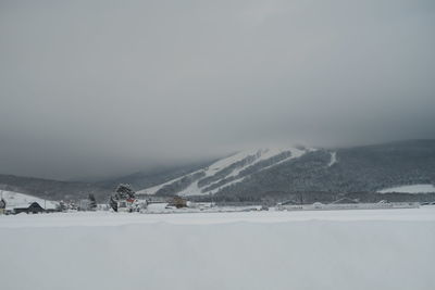 Snow covered mountain against sky