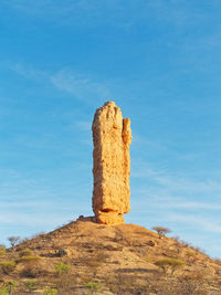 Low angle view of rock formations against sky