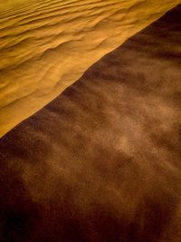 Scenic view of desert against sky during sunset