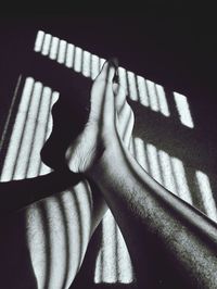 Close-up of hand on shadow