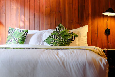 White table on bed against wall at home