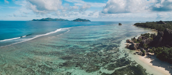 Panoramic view of sea against cloudy sky