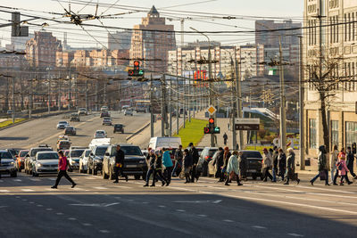 Pedestrians crossing the road in the morning in central streets of tula, russia - october 23, 2021
