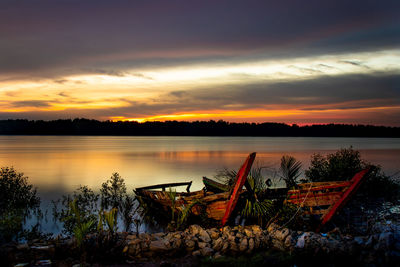 Scenic view of lake against sky during sunset