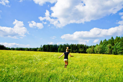Full length of man on field against sky