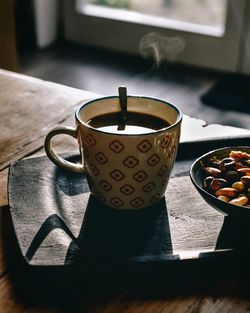 Close-up of coffee cup on table