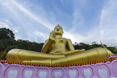 Low angle view of statue against sky