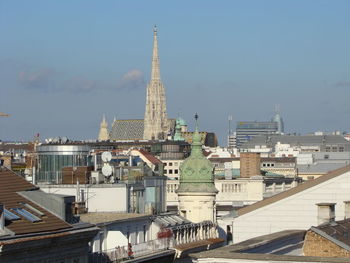 Buildings in city against sky