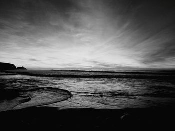 Scenic view of sea against sky at dusk