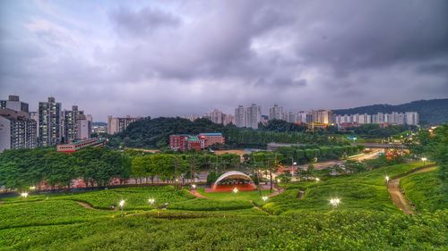 Panoramic view of buildings and city against sky