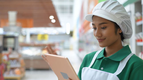 Woman working in supermarket