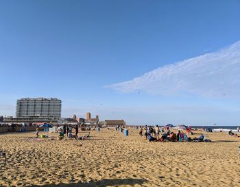 People on beach against sky